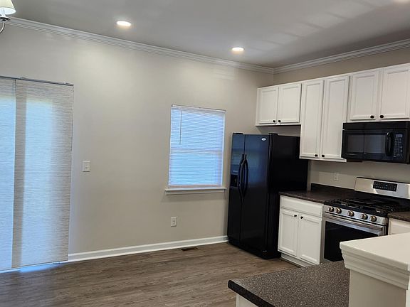 Bright open kitchen with gas range