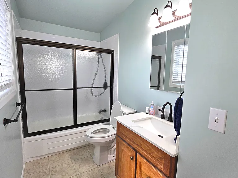 Bathroom 2 of 2 with shower/tub off primary room.