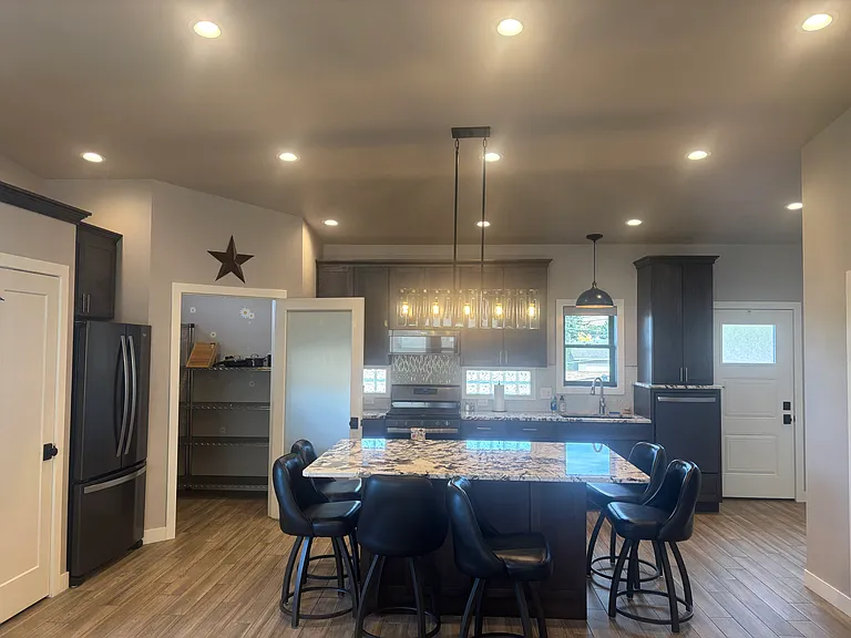 close up of kitchen with pantry door open