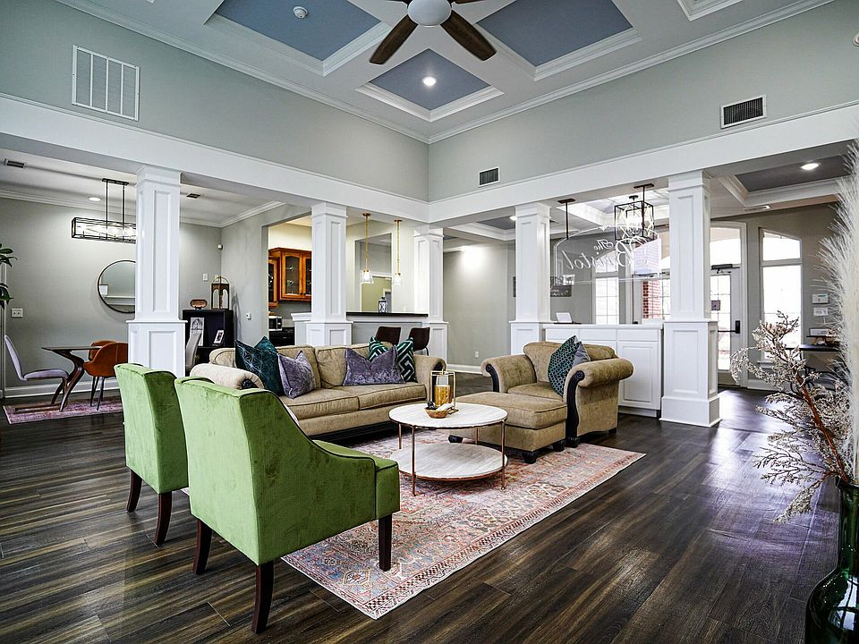 Whether you're hosting or relaxing, the clubhouse at The Bristol offers welcoming spaces like a community kitchen, dining area, and comfortable lounge seating.