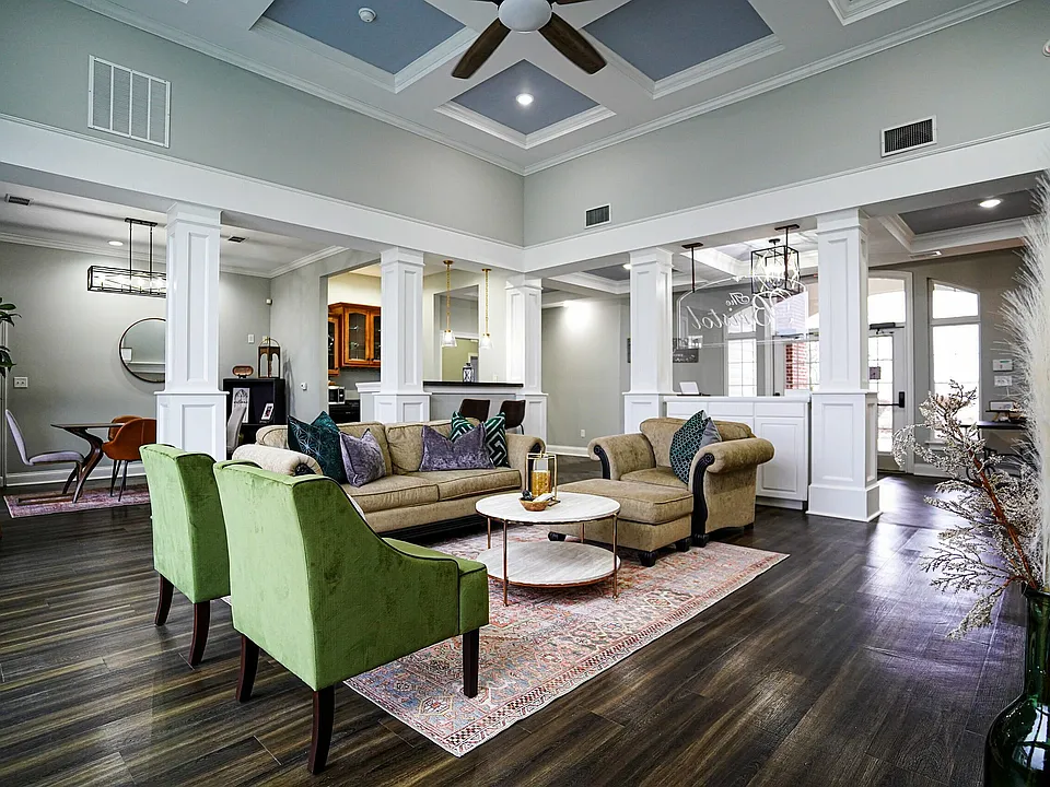 Whether you're hosting or relaxing, the clubhouse at The Bristol offers welcoming spaces like a community kitchen, dining area, and comfortable lounge seating.