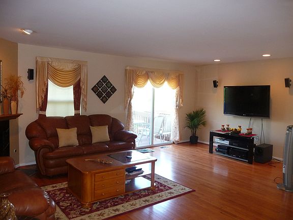 huge living room w/ hardwood floors and gas fireplace