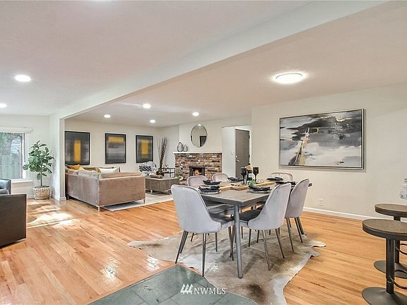 Open floor plan with newly refinished hardwood floors and fresh interior paint