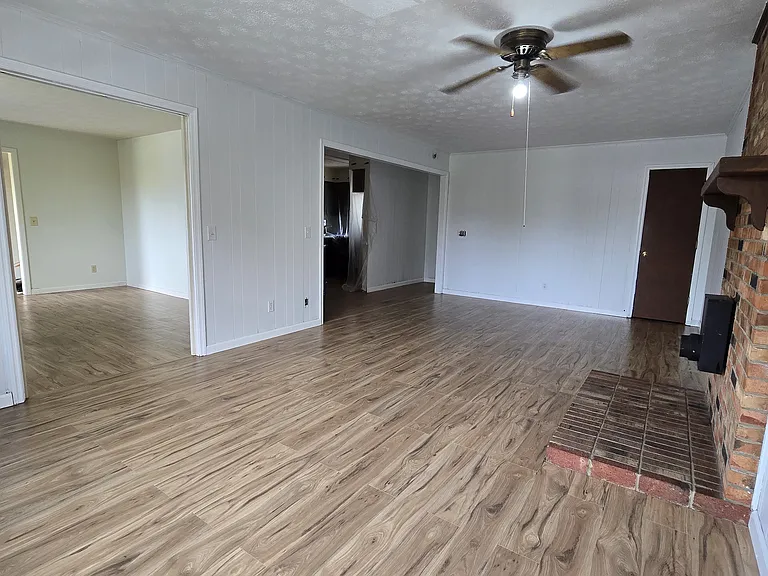 Living room view of sitting room and open kitchen