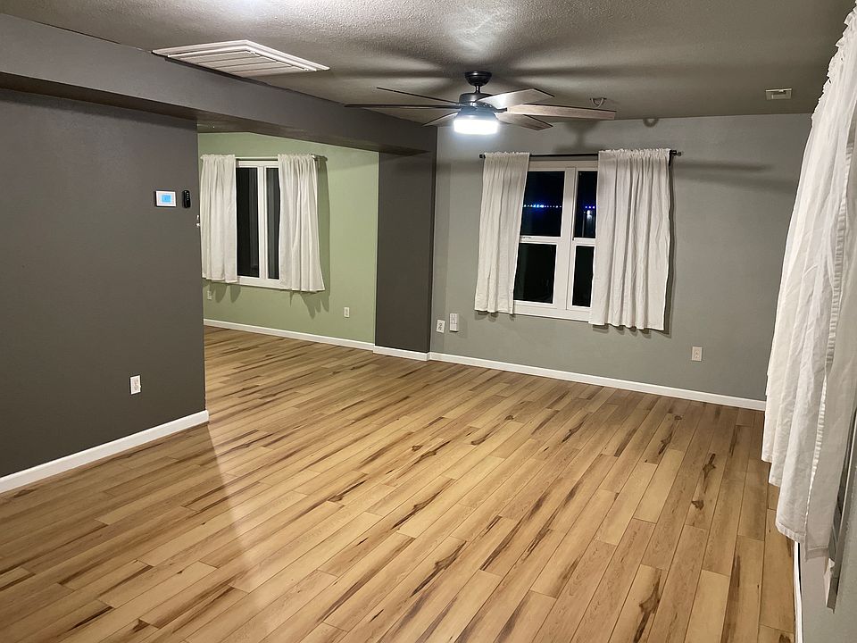 As you enter from the front door into the living room.