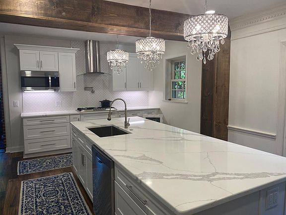 New kitchen, ss, ice maker, large island, double ovens, gas stove and large pantry