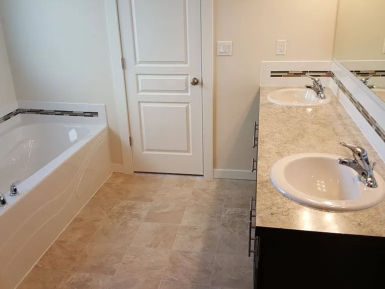 Master bath with tub, shower, separate toilet and walk-in closet