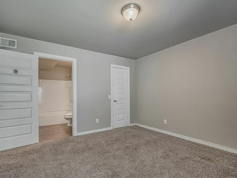 Experience comfort in this well-designed bedroom with an en-suite bathroom for added convenience.