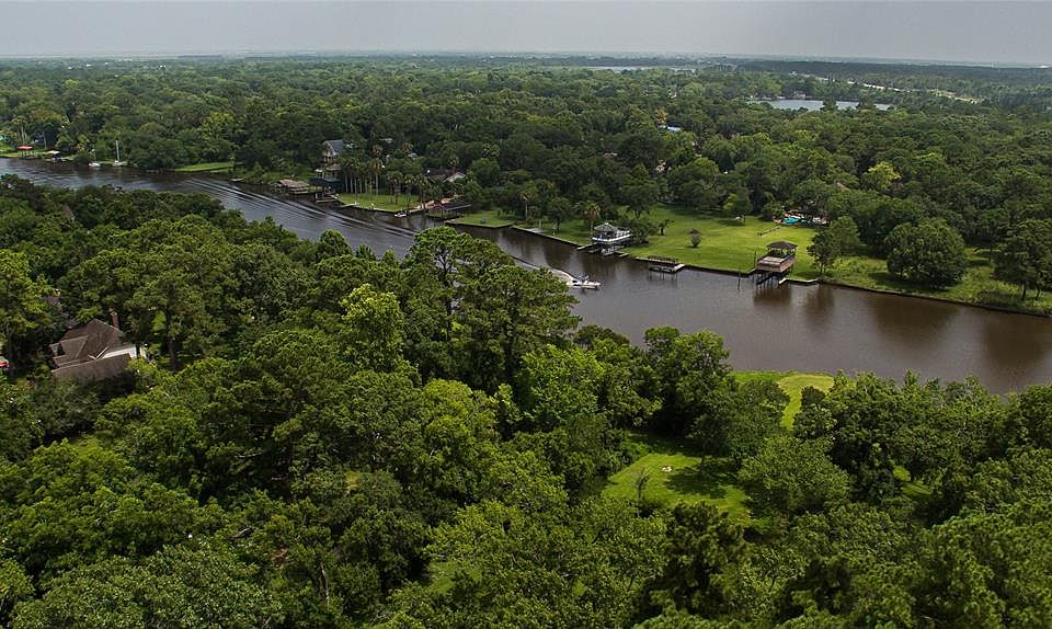 EXPERIENCE LIFE ON THE WATER along Dickinson Bayou with this .944-acre bayou front 3-bed, 2-bath home!
