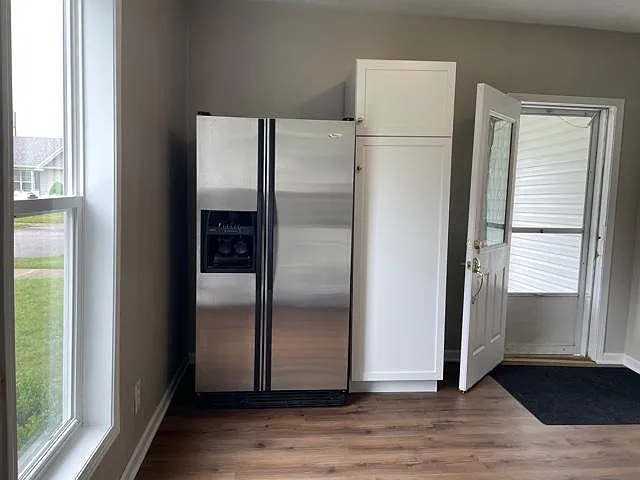 Large pantry and whirlpool fridge.