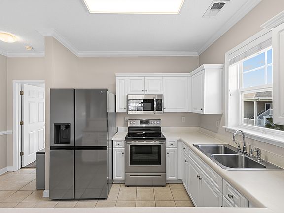 Newer stainless appliances with extra large refrigerator