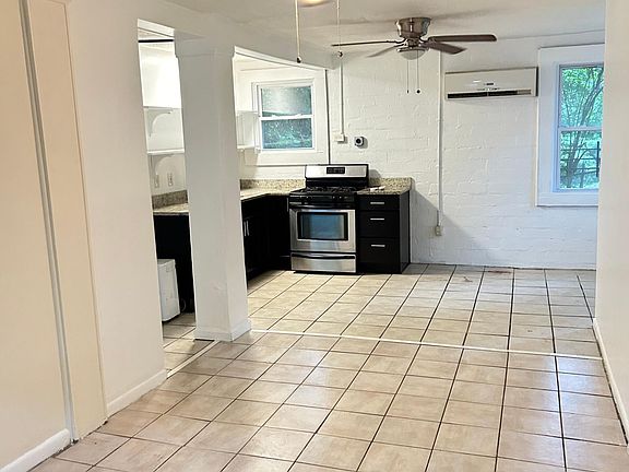 Kitchen and eating area at far end of the living room.