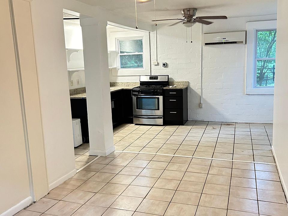 Kitchen and eating area at far end of the living room.
