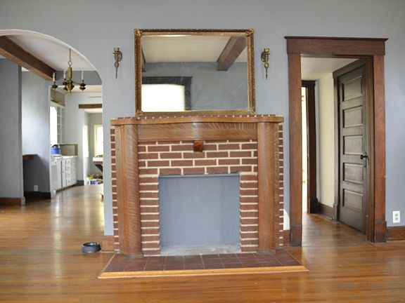 To the left is the dining and kitchen, hallway to the right has door to basement and also leads to back living room/optional 3rd bedroom