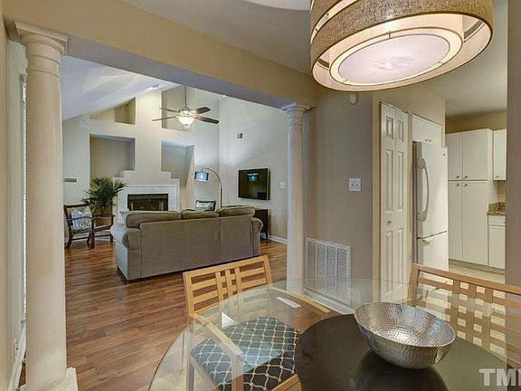 Dining room adjacent to kitchen and living room showing an open concept floor plan