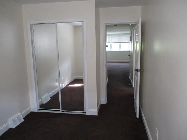 Small Bedroom with Sliding Glass Doors for Closet