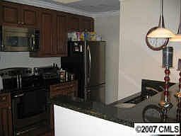 Updated kitchen with granite and stainless steel appliances