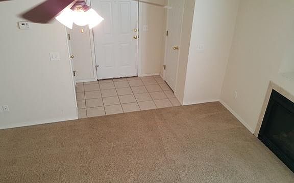 Tile entry with coat closet and gas fireplace