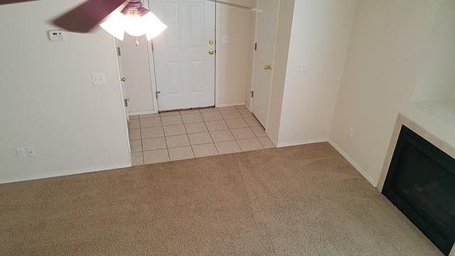 Tile entry with coat closet and gas fireplace