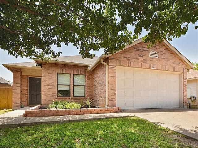 Located on a cul-de-sac, this one story brick home is close to shopping and schools