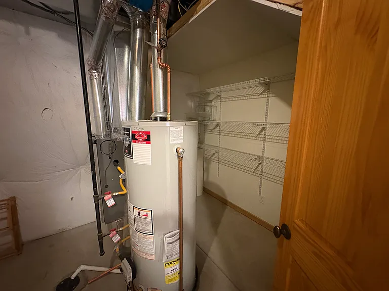 Ample storage in downstairs laundry/mechanical room