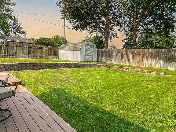 Large Split Level Backyard. New improvements include garden box, and french drain to keep rainwater away from the house and the wrap around porch.