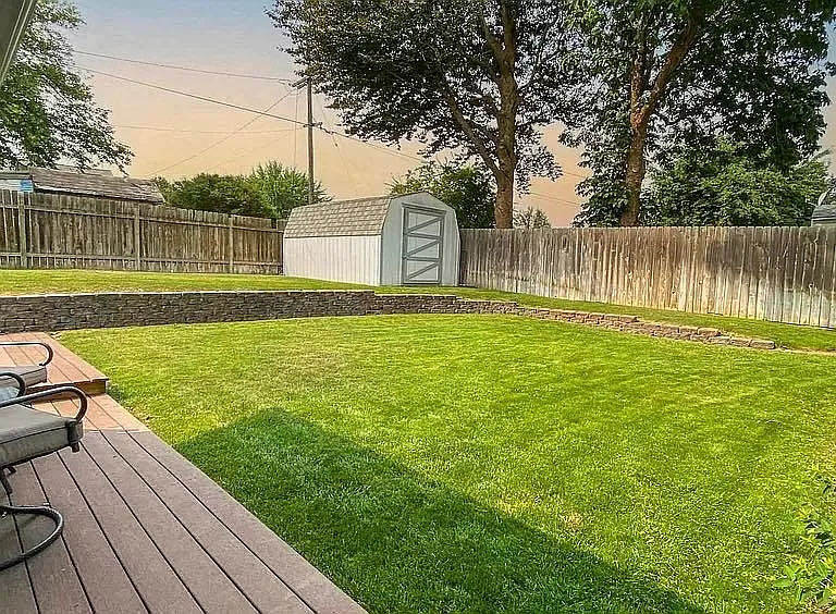 Large Split Level Backyard. New improvements include garden box, and french drain to keep rainwater away from the house and the wrap around porch.