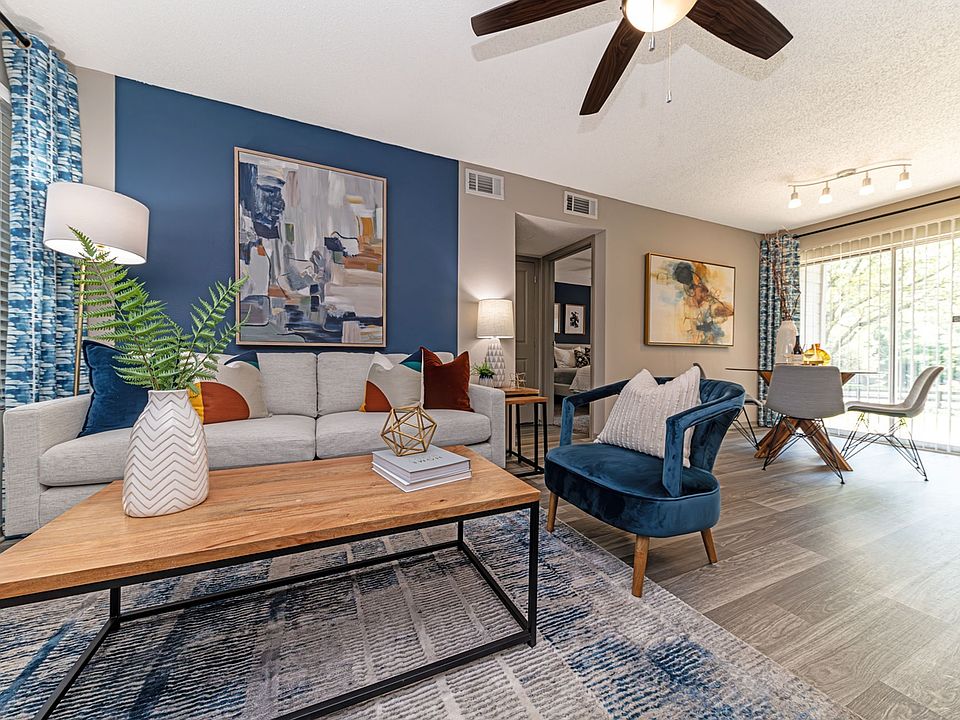 Living room and dining area with hardwood-style flooring