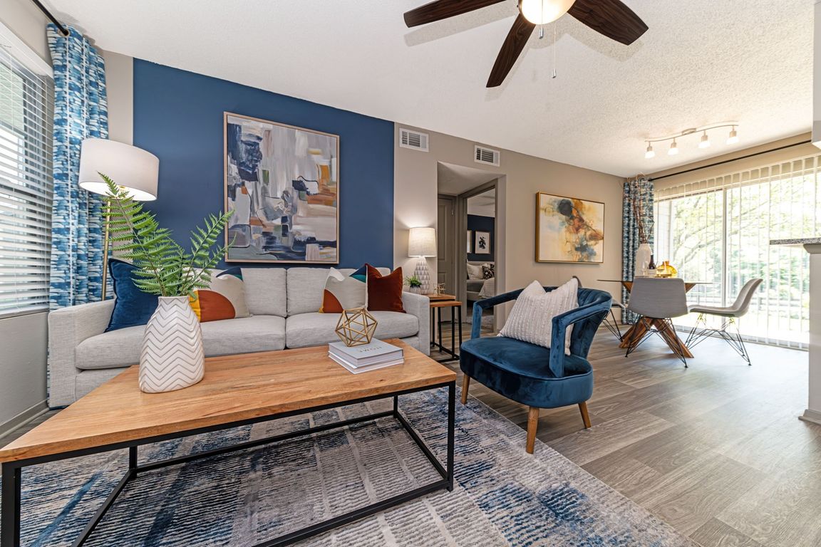 Living room and dining area with hardwood-style flooring