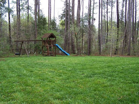 Large Backyard with swingset after a little rain...