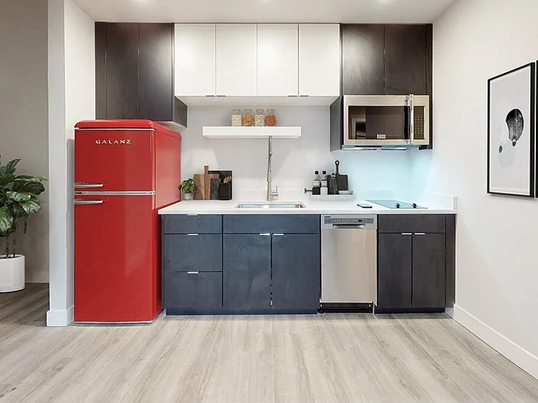 Efficient Kitchen Design with Quartz Counters Near Entryway