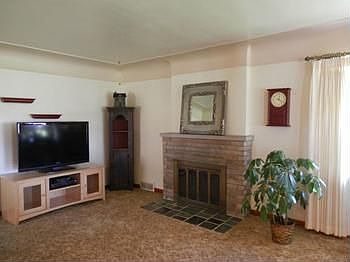 Living room offers a wood burning fireplace