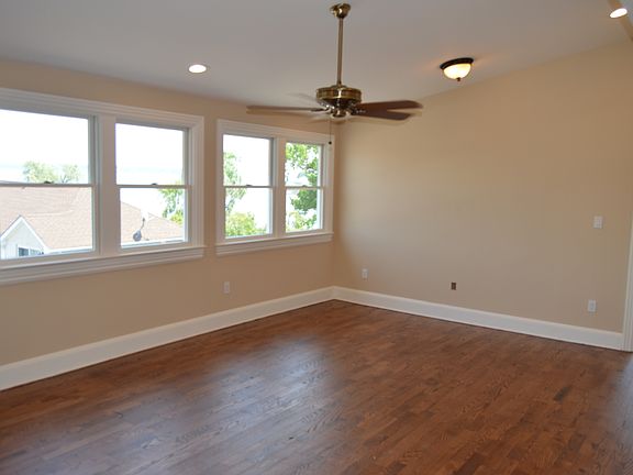 high ceiling living room, with ceiling fan