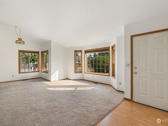 Entry-Dining and living room with bay windows>