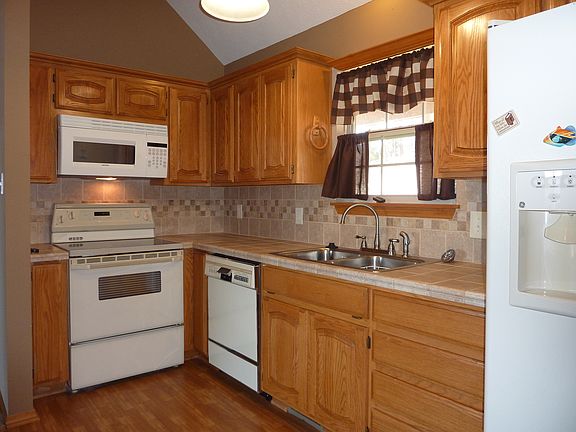 Oak cabinets Tile countertop