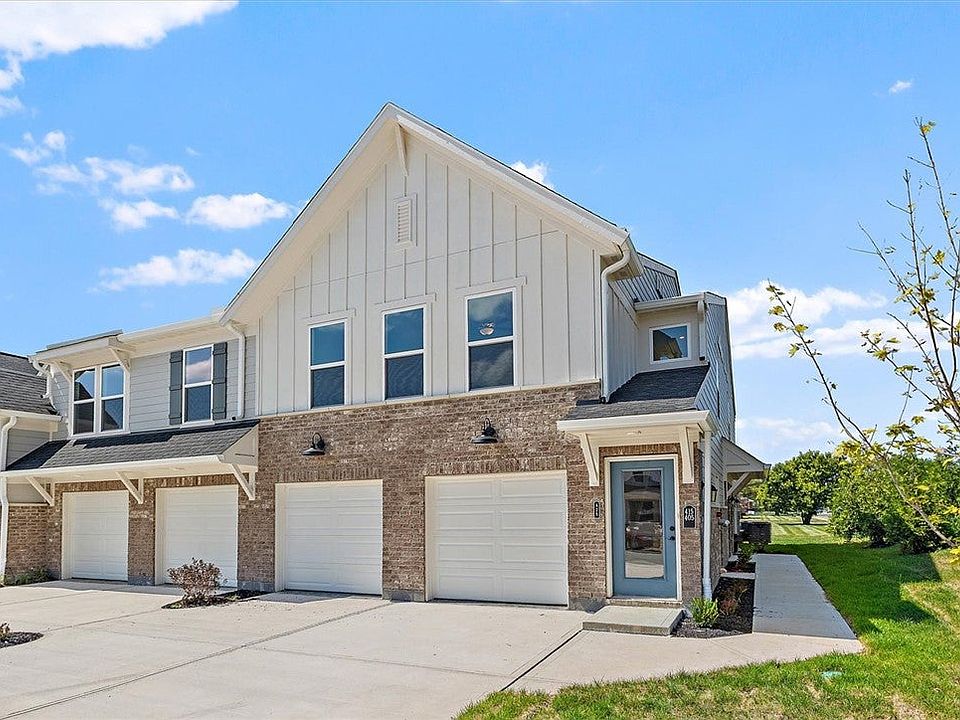 A modern multi-family exterior displays a mix of b