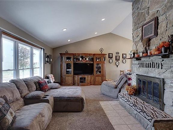 Beautiful vaulted ceilings, a gorgeous stone fireplace and view of the land from the front windows.