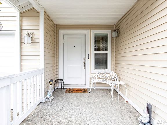 Cozy front porch waiting for your personal touch!