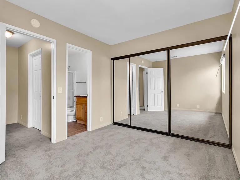 Primary Bedroom with door to Full Bathroom.