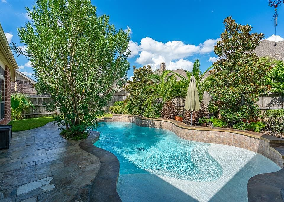 Beat the Texas heat in your pool with a sundeck.