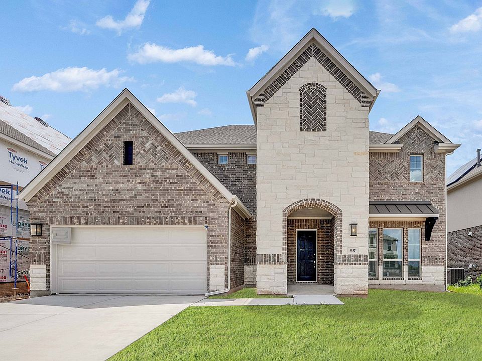 Bask in this Hawkes Landing home s grand arched entry and refined brickwork, exuding unparalleled el