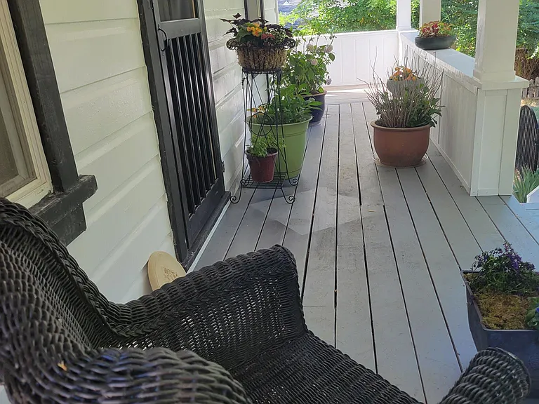 Picture of the covered front porch when I lived here. Furniture and plants, etc, not included.