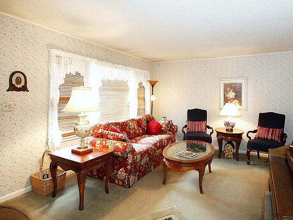 Very cozy living area will make you feel right at home with large front window