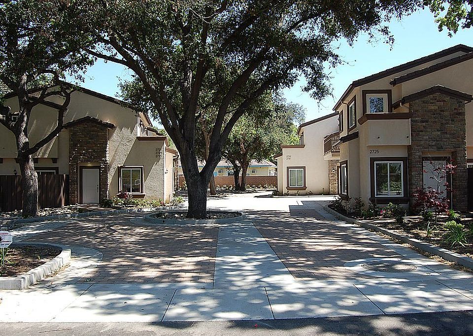 Magnificent Oak Trees welcome you into this complex.