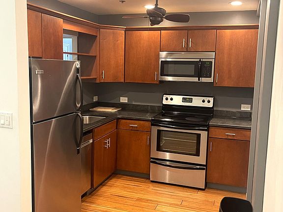 Full stocked kitchen featuring stainless steel appliances.