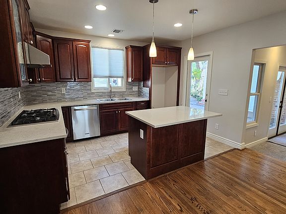 Mountain views from kitchen window, open to dining area and step-down family room