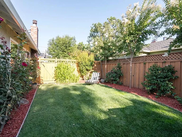 Lawn next to patio and spa