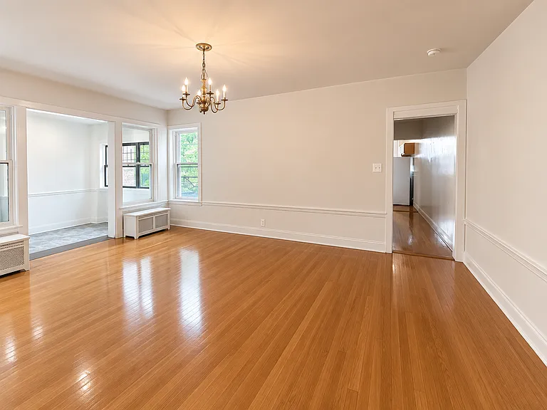 Formal dining room with hallway leading to 4th bedroom, 2nd full bath and kitchen