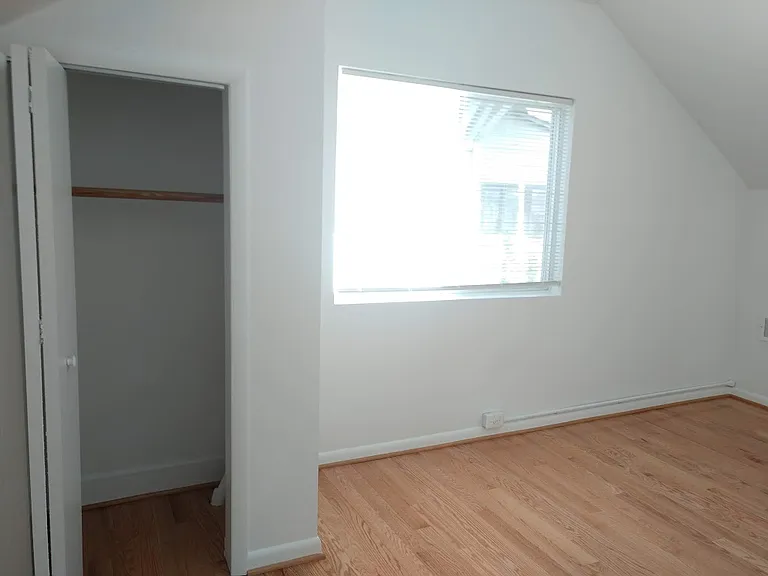 Bedroom has closet. Additional storage is across the hall from bedroom.