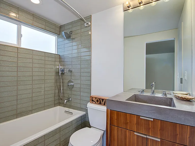 Master bath with deep, comfortable tub & fixtures.